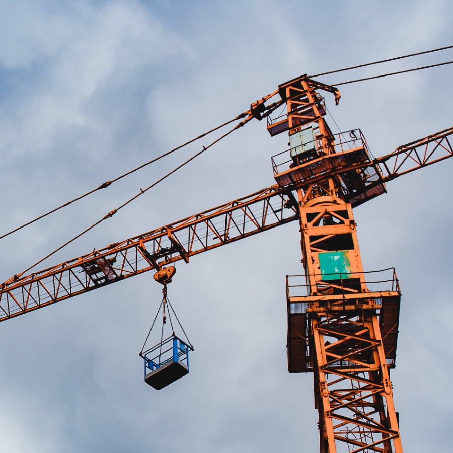City crane with sunset reflections