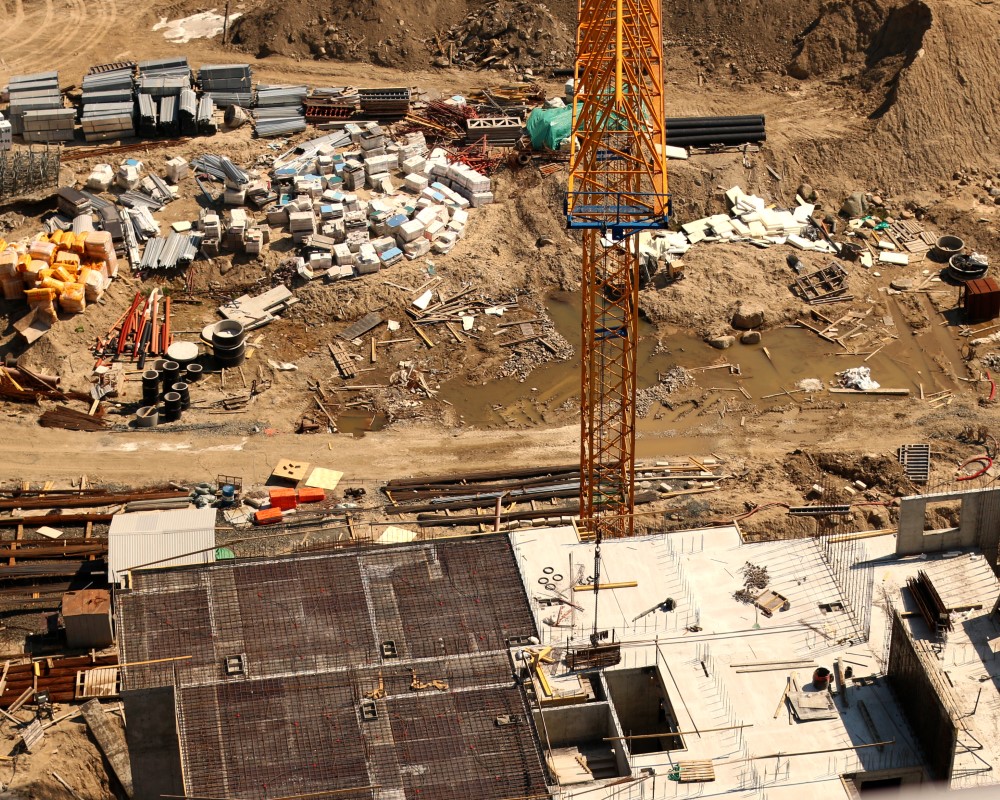 City crane beside scaffold tower