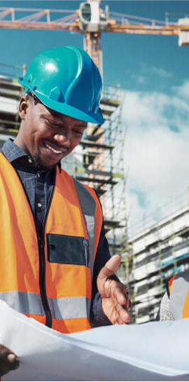 Worker carrying beam on deck